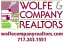 Wolfe & Company Realtors logo