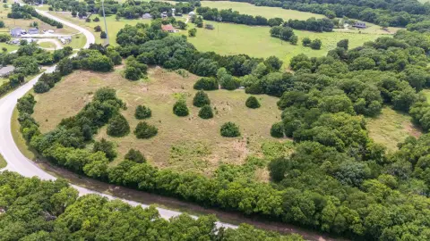 Unrestricted Corner Acreage with Pond