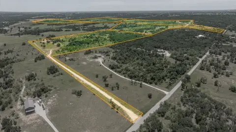 Fenced Acreage with Water Tanks