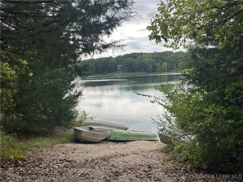Wooded Lot Overlooking Treeline Lake