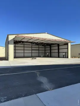 Aircraft Hangar with Hydraulic Pivot Door