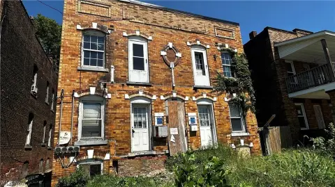Brick Quadplex Requiring Renovation