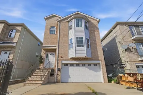 Three-Family Triplex with Driveway & Garage