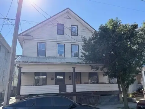 Two-Story Duplex with Walk-Up Attics