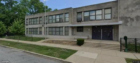 School Building with Fenced Playground
