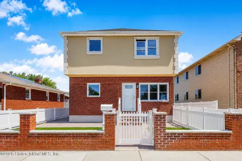 Upgraded Two-Family with Finished Basement