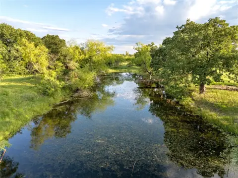 28-Acre Farmland with Pond and Barns