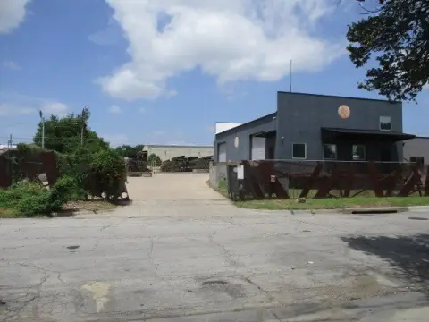Fenced Warehouse with Overhead Doors