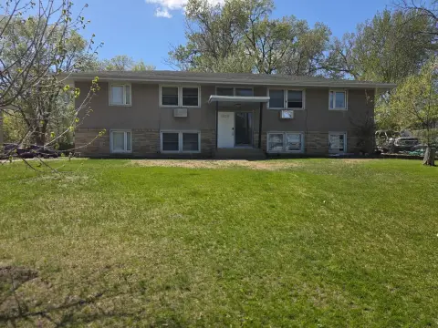 Stucco Four-Plex with Off-Street Parking