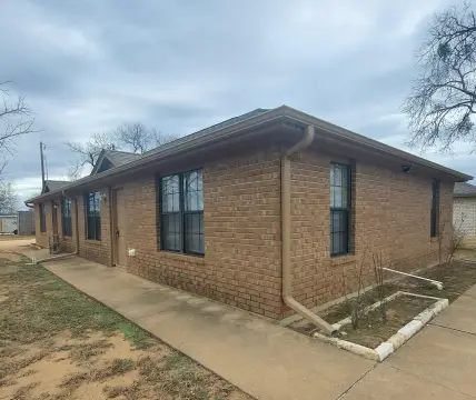 Brick Duplex with Vinyl Flooring