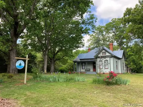 Farmhouse with Wooded Land