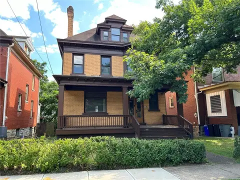 Brick Duplex with Three-Floor Layout
