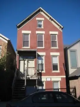 Brick Triplex With Coach House