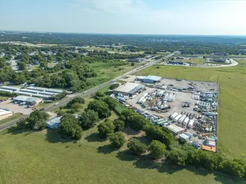Industrial Land Tract with Farmhouse