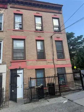 Attached Three-Family Brick Residence