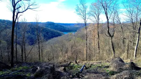 Land with Sunset Lake Views