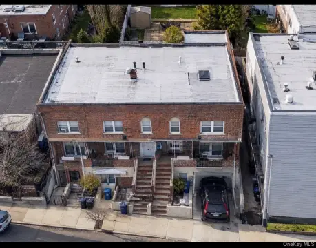 Three-Family Brick Triplex with Backyard
