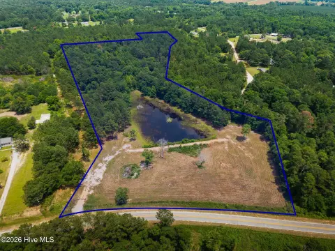 Acreage with Pond and Storage Shop