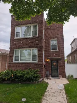 Income-Producing Two-Flat with Value-Add Potential