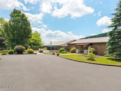 Brick Triplex with Detached Garages