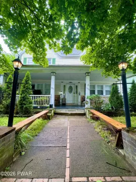 Tenant-Occupied Duplex with Carport
