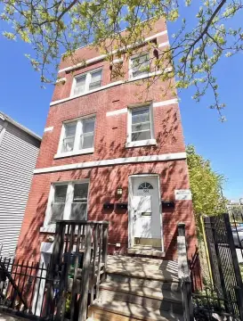 Brick Triplex Near Redevelopment Site