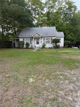 Occupied Duplex with Mature Trees