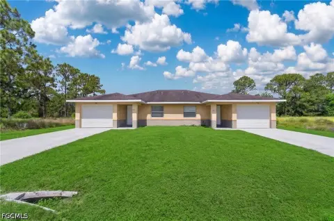 Well-Maintained Duplex with Two Garages