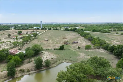 Fenced Agricultural Land with Pond
