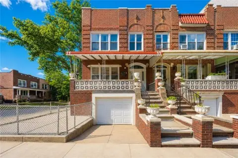 Renovated Three-Family Corner Brick Home