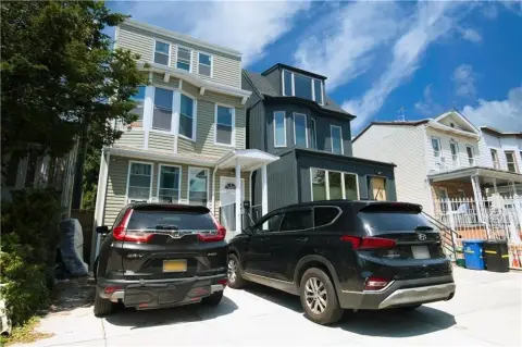 Two-Family Home with Private Driveway