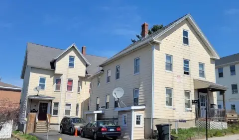 Two Triple Decker Apartment Buildings