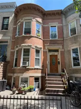 Limestone and Brick Two-Family Home