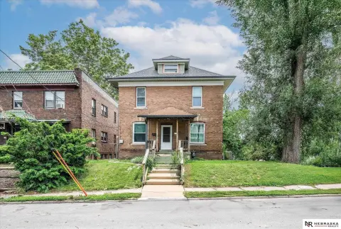 Updated Triplex with Rental Income