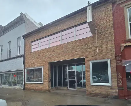 Live-Work Building with Apartment Above