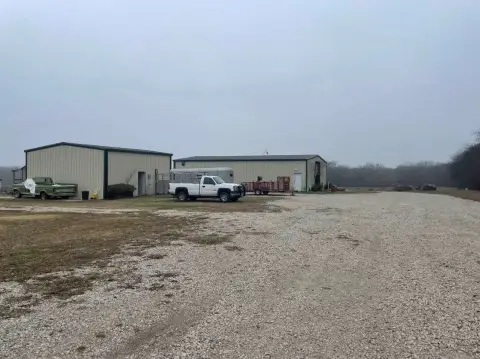 Commercial-Zoned Land with Barns