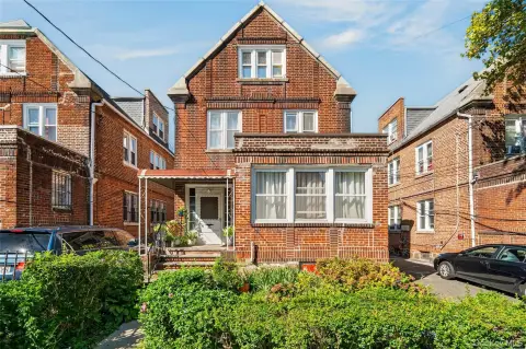 Brick Triplex With Two-Car Garage
