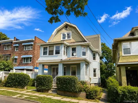 Colonial Triplex with Detached Garage