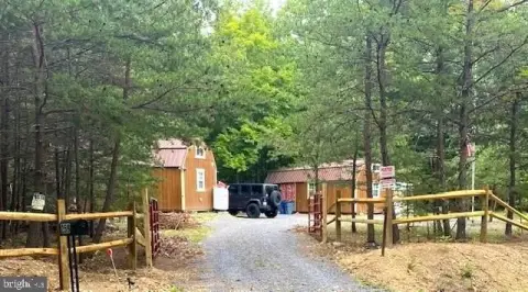 Two Cabins with Mountain Stream