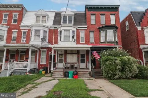 Brick Triplex With Detached Garage