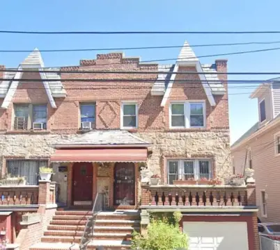 Brick Tudor Three-Family Residence