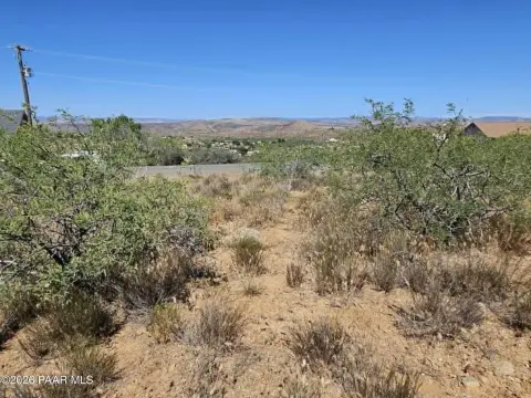 Land with Mountain and Town Views