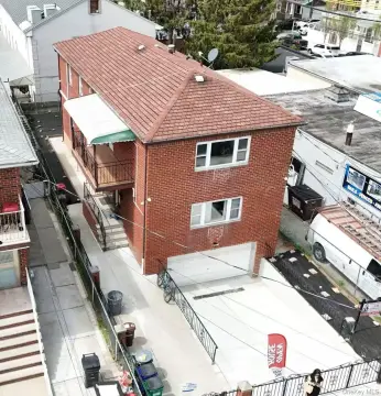 Well-Maintained Two-Family Brick Residence