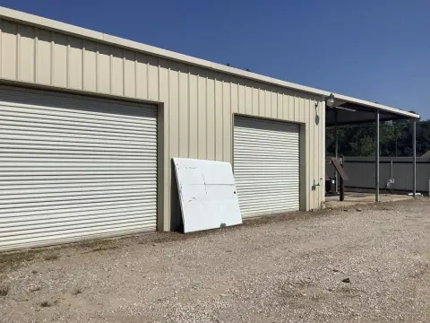 Fenced Warehouse with Paint Shop