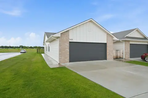 Like-New Twin Home with Zero-Entry