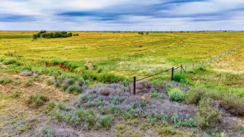 Fully Fenced Acreage with Water Wells