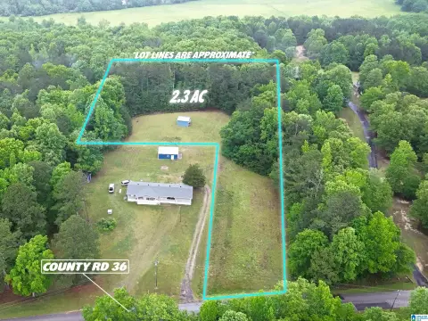 Partially Cleared Land with Carport