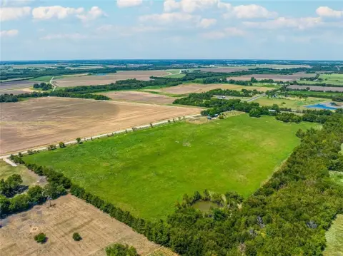 Cleared Land with Pond Near Paris
