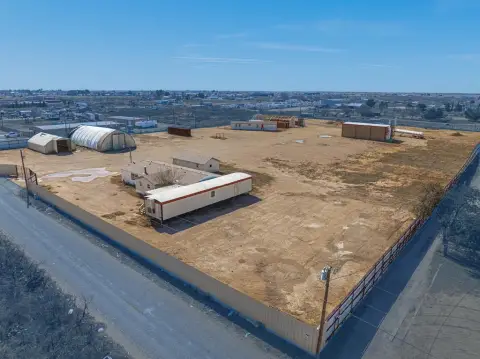 Fenced Industrial Land with Structures