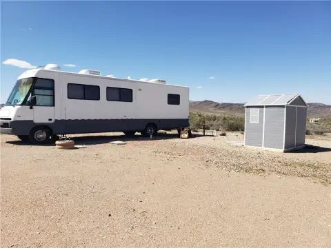 Land with Winnebago Adventurer